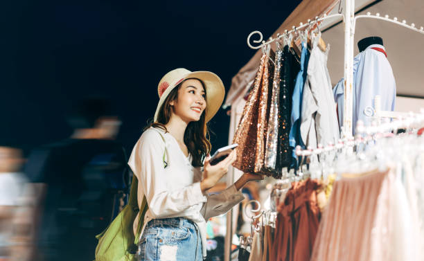 Young adult beautiful woman happy relax outdoor in urban lifestyle at street night market. stock photo