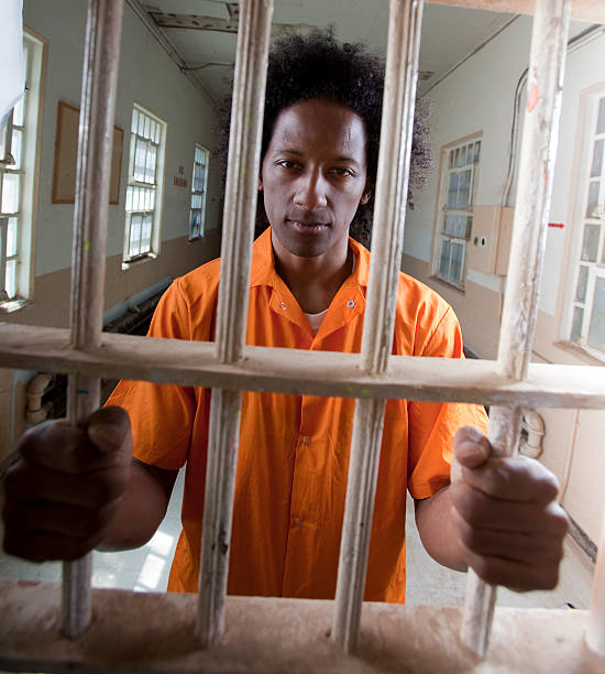 Young African American Man Behind Bars stock photo