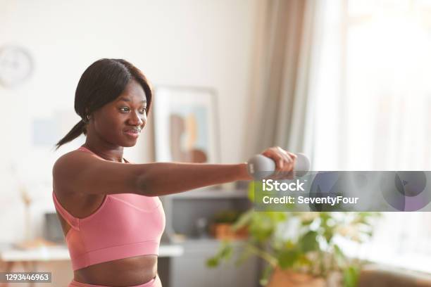 Young African-American Woman Working Out at Home