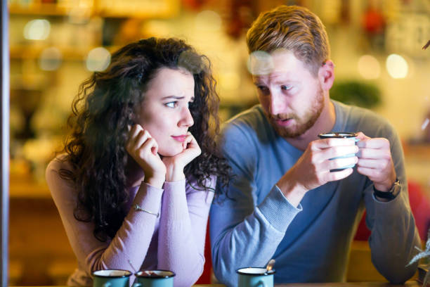 Young attractive couple having problems on date Young attractive couple having problems on date and relationship bad date stock pictures, royalty-free photos & images