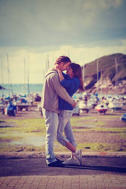 young attractive couple in love , love story - fluisterboot stockfoto's en -beelden