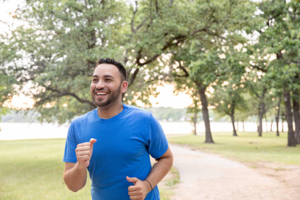 Young Attractive Man Jogging outdoors stock photo