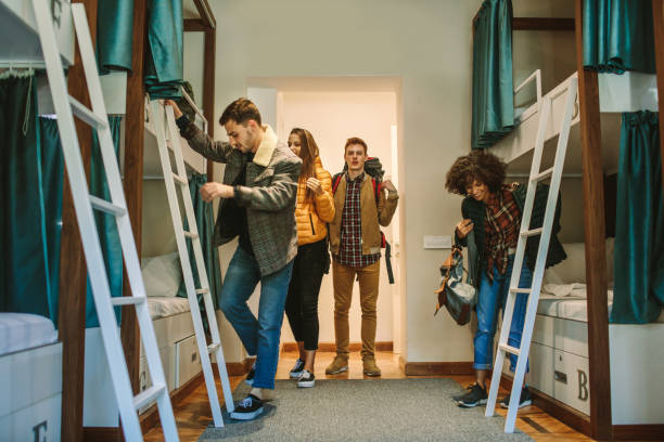 Young Backpackers In Hostel stock photo