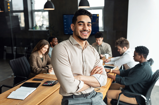 young-bearded-businessman-sitting-on-desk-and-posing-picture-id1322913815?b=1&k=20&m=1322913815&s=170667a&w=0&h=rvURoK1t_rjAf09De0F5v6L9_wgJrUuZK_cw3vjPgDM=