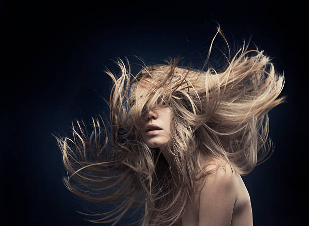 young beautiful women with flying hair stock photo