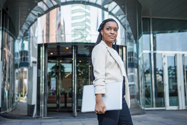 A young black ethnicity female businesswoman at business reopening stock photo
