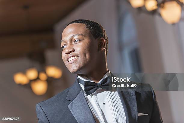 Young black Hispanic man wearing tuxedo