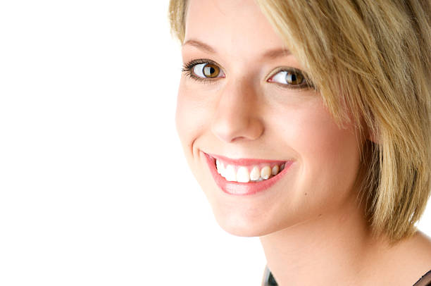 Young blond smiling woman with short hair stock photo