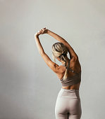 istock A young blonde Caucasian woman stretching 1340792495