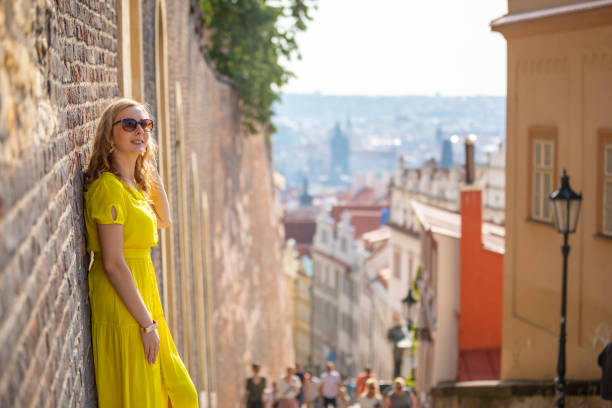 Young blonde woman exploring old town of Prague in sunny day, Czech republic Young blonde woman exploring old town of Prague in sunny day in Czech republic bohemia czech republic stock pictures, royalty-free photos & images