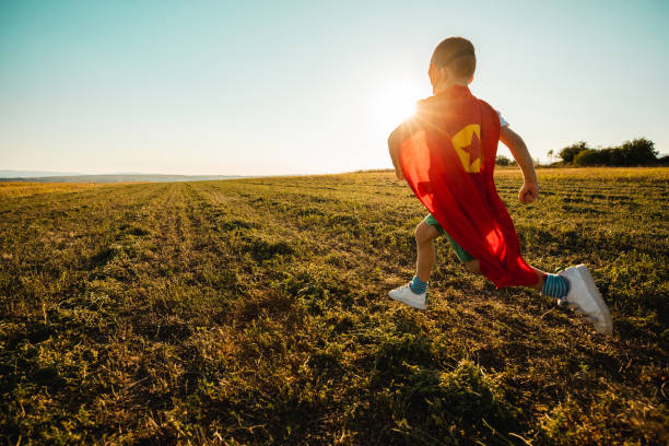 Young Boy Dressed as Superhero stock photo