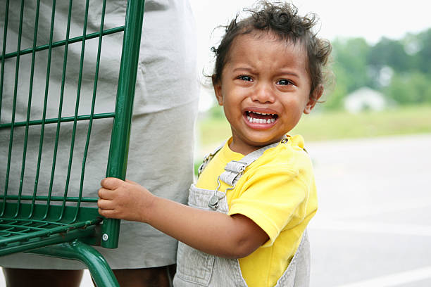 Young boy having a temper tantrum stock photo