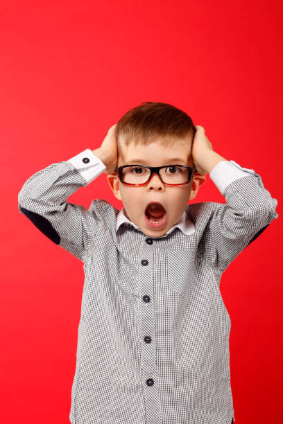 Young boy is terrified stock photo