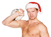 istock Young brawny sportsman In a New Year's cap 135015368