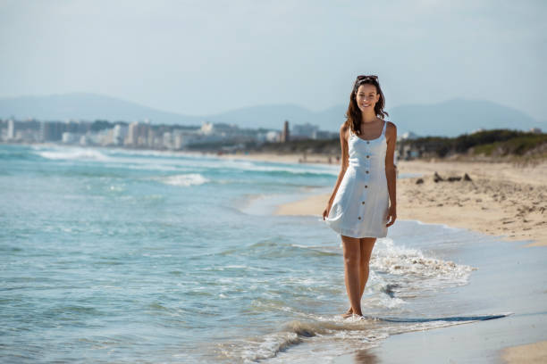 young brunette on vacation on Majorca on a beach stock photo