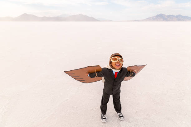 Young Business Boy Taking Flight stock photo