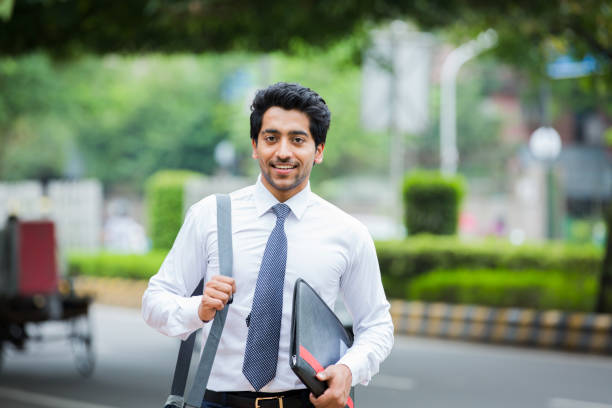 Young Businessman on the city. stock photo Indian Ethnicity, Men, Businessman, Business, Cheerful men facts  stock pictures, royalty-free photos & images