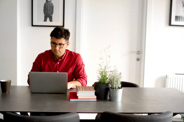 Young businessman working from home stock photo