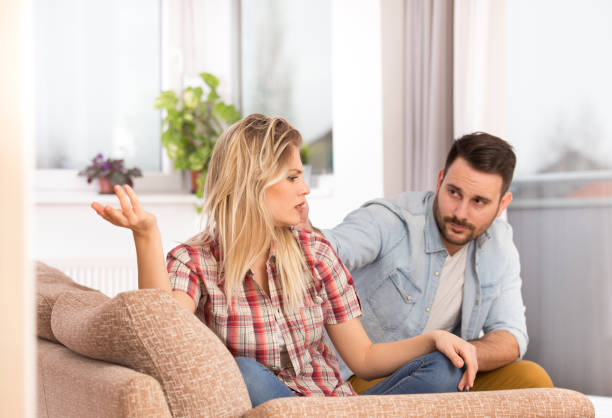 Young couple arguing at home stock photo