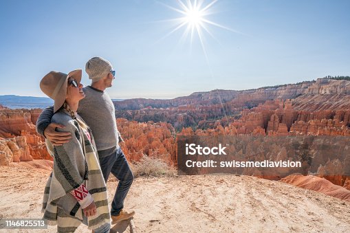 istock Young couple contemplating nature enjoying travel and adventure - America 1146825513