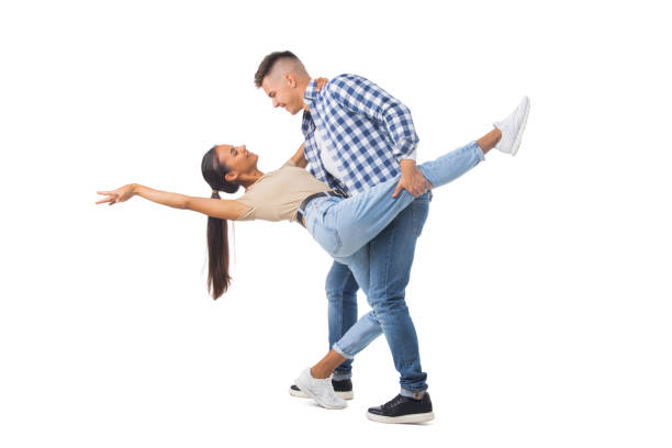 Young couple dancing on white stock photo