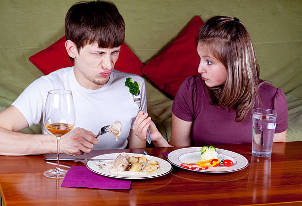 Young couple having a dinner stock photo