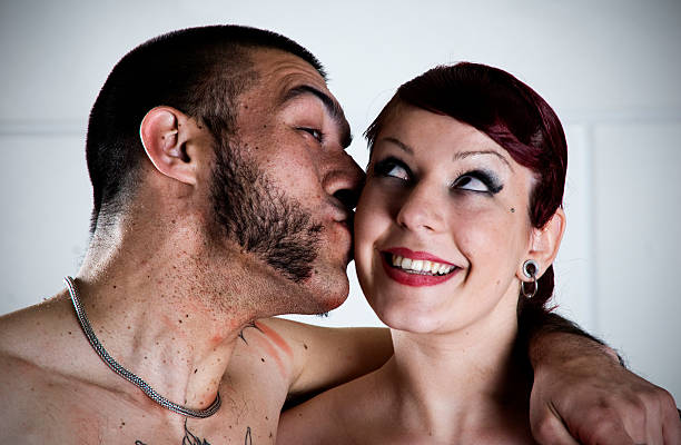 Young couple kissing Heavily in love young couple kissing. mutton chops stock pictures, royalty-free photos & images