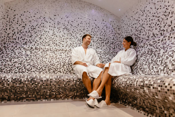 Young couple relaxing in the steam bathroom or sauna Young couple relaxing in the steam bathroom or sauna turkish bath photos stock pictures, royalty-free photos & images