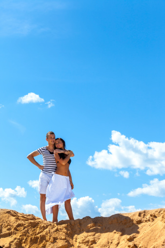 Young couple under the blue sky (man and woman)