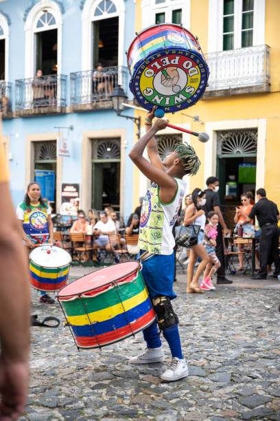 young drummer school playing at historic Center Pelourinho in Salvador stock photo