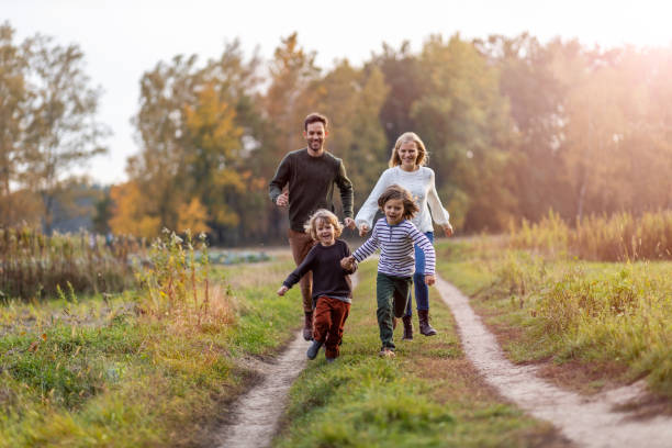Young family having fun outdoors Young family having fun outdoors autumn photos stock pictures, royalty-free photos & images