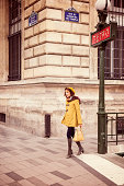 Young fashionable woman in autumn clothes coming out the metro in parisian street. This is from the iStockalypse Paris.