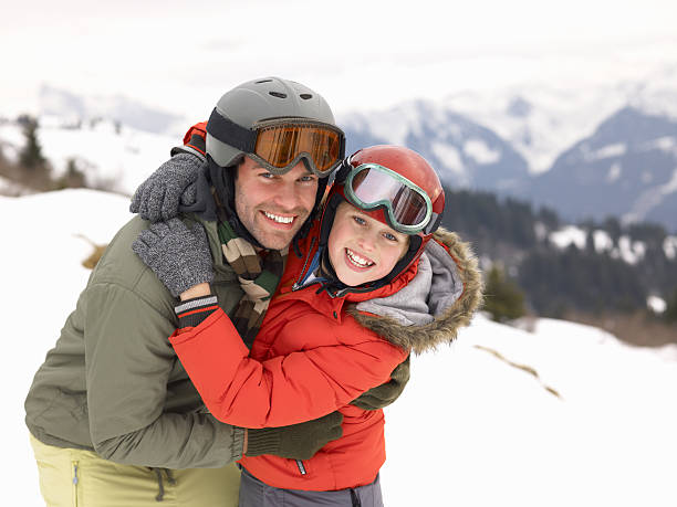 Young Father And Son On Winter Vacation stock photo
