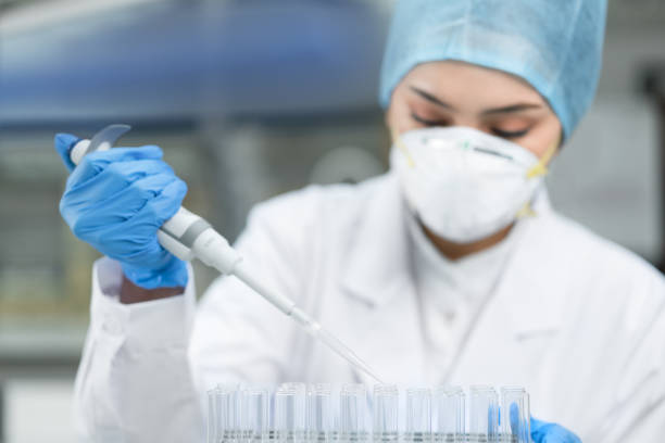 Young female scientist working in the laboratory stock photo
