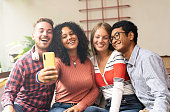 istock Young friends group making selfie with smartphone - Community concept with multicultural and multiethnic friends having fun video calling with friends - Diversity and friendship concept 1349717207