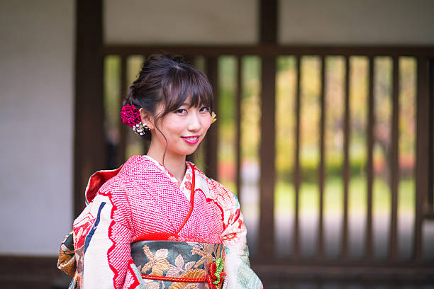 Young furisode girl sitting on bench Young furisode girl sitting on bench furisode stock pictures, royalty-free photos & images