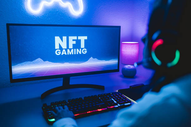 Young gamer buying NFT with token on marketplace platform for metaverse video game - Crypto technology trends - Focus on computer monitor stock photo