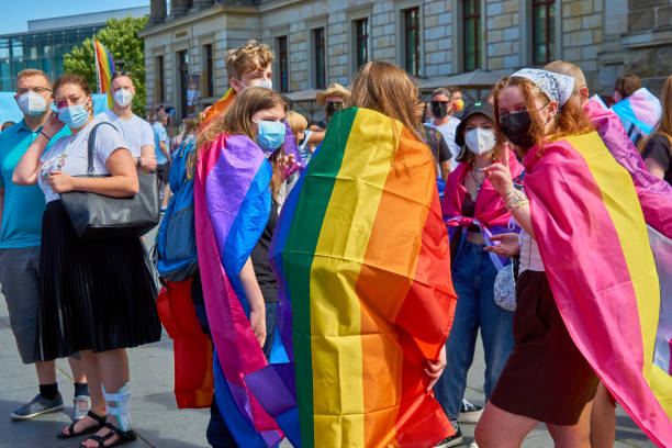 Young German women with capes in the colors of the rainbow at CSD, Christopher Street day stock photo