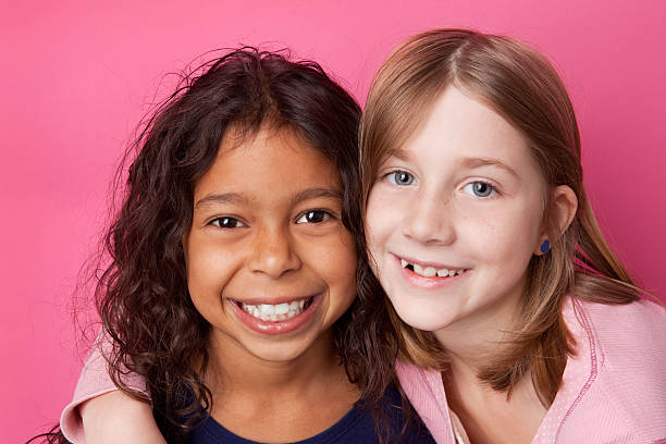 Young Girl Best Friends Two beautiful 9 year old girls smiling. cute puerto rican girls stock pictures, royalty-free photos & images