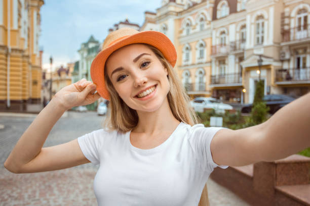 Young girl blonde hair tourist city travel Young woman tourist city walk taking photos free cam to cam stock pictures, royalty-free photos & images