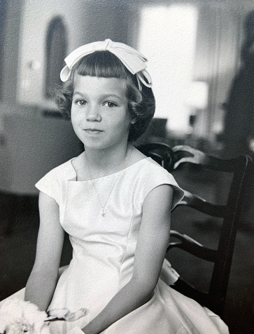 Young girl bridesmaid in 1950s