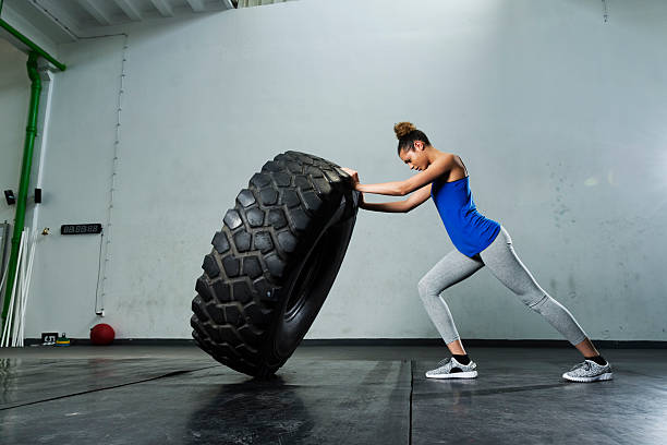 deeply tone batch 1,532 Woman Lifting Tire Stock Photos, Pictures & Royalty-Free Images -  iStock
