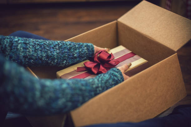 Young girl getting parcel on Christmas stock photo