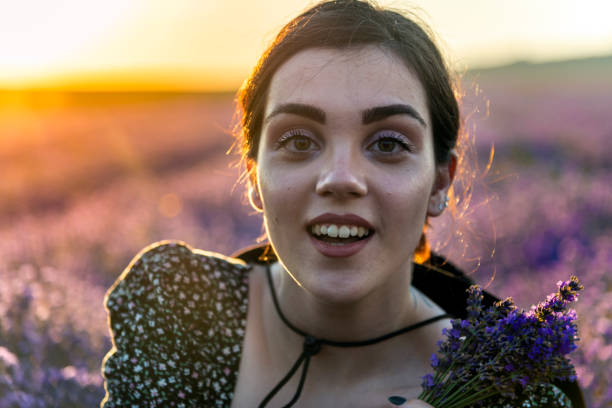 Young girl in a field of lavander stock photo