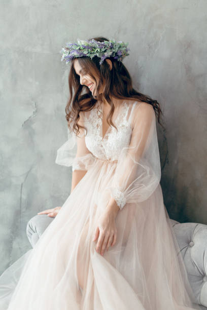 young girl in beautiful dress posing in studio stock photo