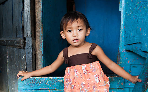 Young girl living in poverty Adorable young girl living in poverty. Manila, Philippines. philippine girl stock pictures, royalty-free photos & images