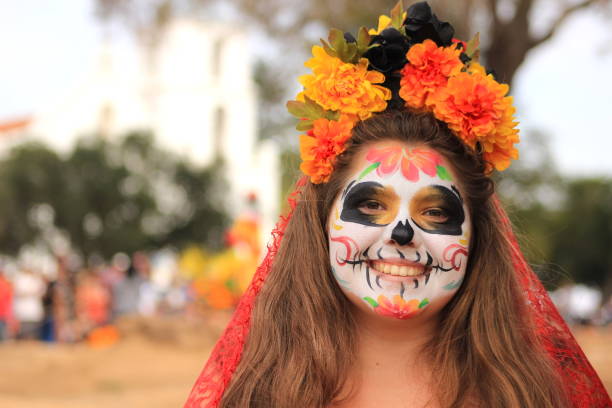 Young girl wearing sugar skull makeup (Catrina) for Day of the Dead celebration stock photo