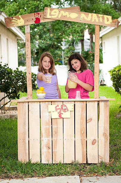 Young girls selling lemonade stock photo