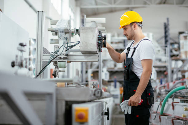 Young handsome factory worker. stock photo