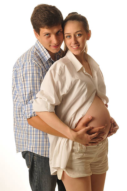 Young happy couple in awaiting birth of the child stock photo